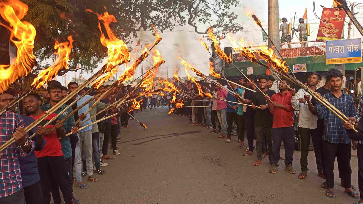Students take out torch procession in Dumka