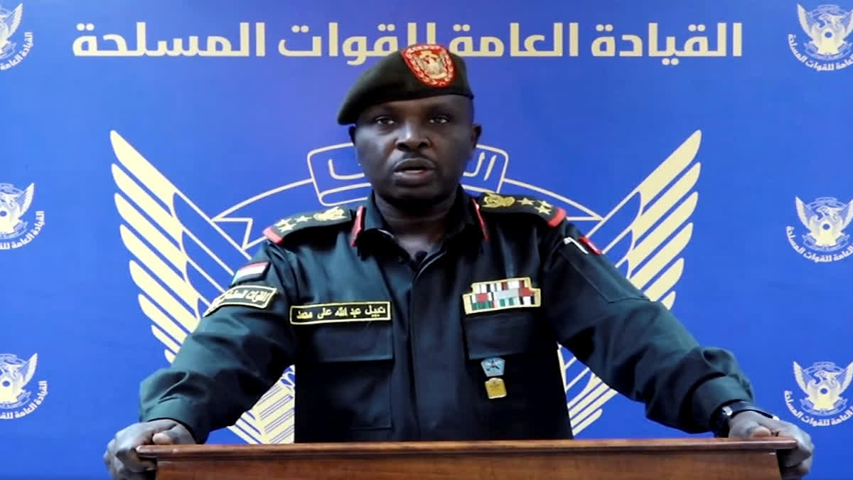 In this frame grab from a video posted by Sudan's state news agency, SUNA on Thursday, April 13, 2023, spokesman for the Sudanese Armed Forces Brig. Nabil Abdullah reads a statement warning of conflict after the recent deployment of Sudan's powerful paramilitary in the capital and other cities. Tensions between the military and the paramilitary, the Rapid Support Forces (RSF), have escalated in recent months, forcing a delay of the signing of an internationally-backed deal with political parties to restore the country's democratic transition. In the statement, the military said the buildup of the RSF in Khartoum and elsewhere in the country has come without "the approval of, or coordination with" the armed forces' leadership.