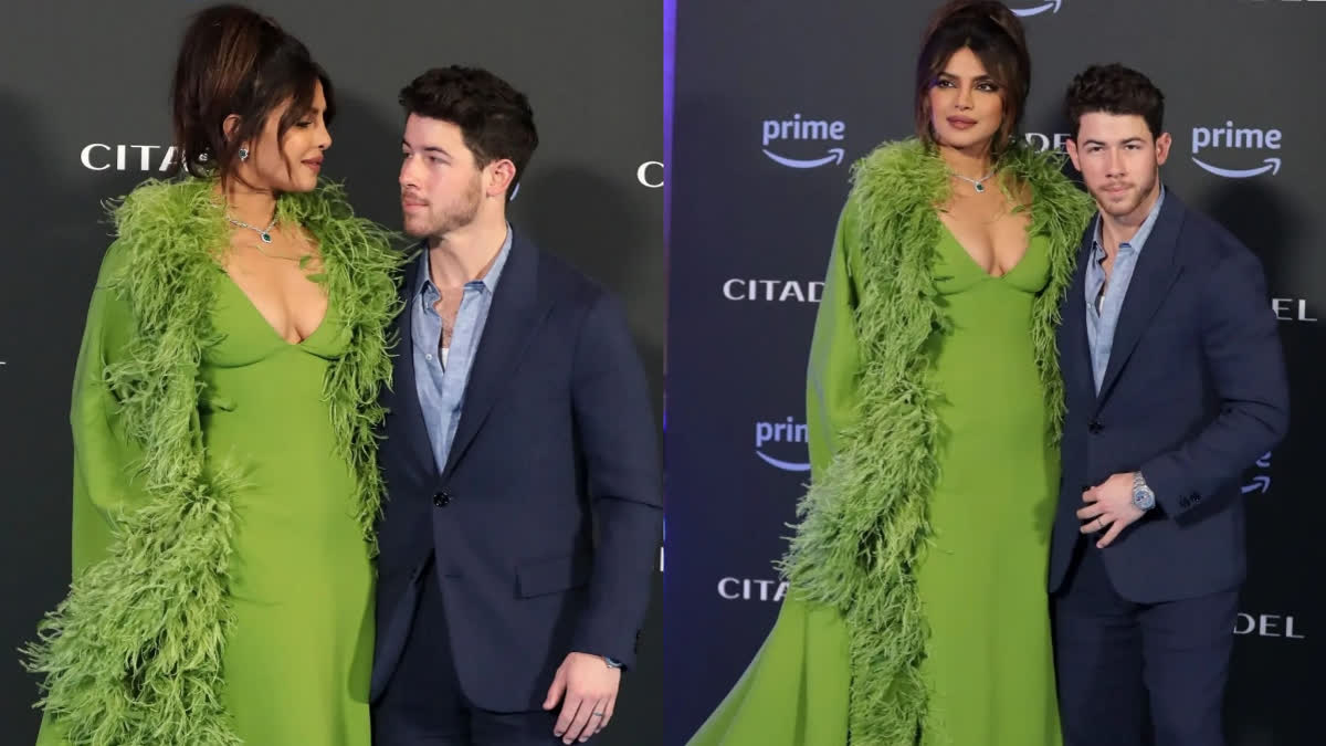 Nick Jonas serves as Priyanka Chopra's personal photographer as she greets paparazzi with namaste at Rome's Citadel premiere