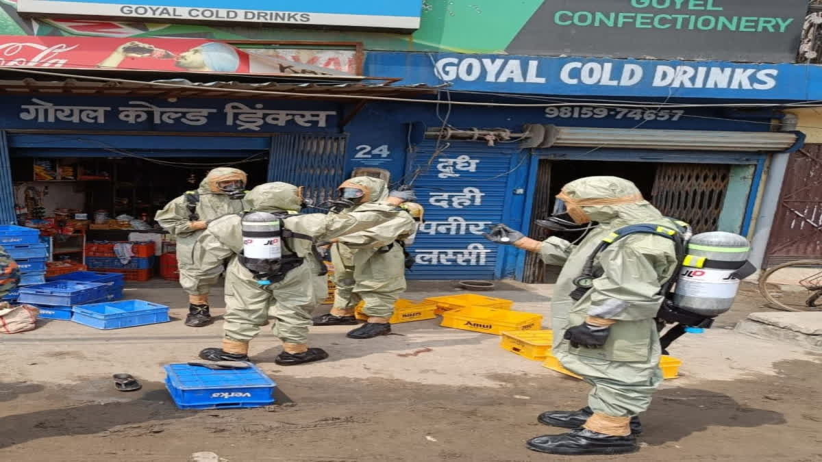 Masked NDRF men at the spot.