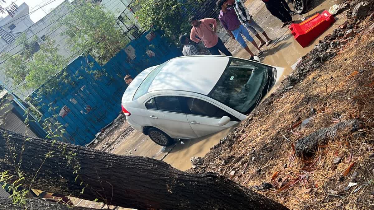Car sunken in pit filled with rain water in Indore