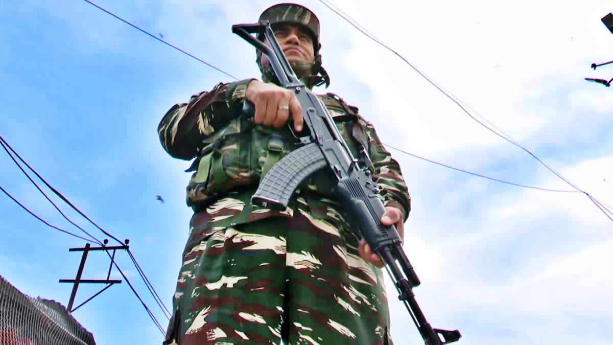 Army Jawan standing with his gun in JK