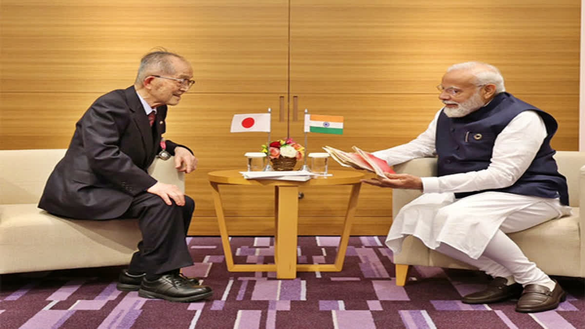 PM Modi interacts with renowned Japanese author, Padma Shri awardee Tomio Mizokami in Hiroshima