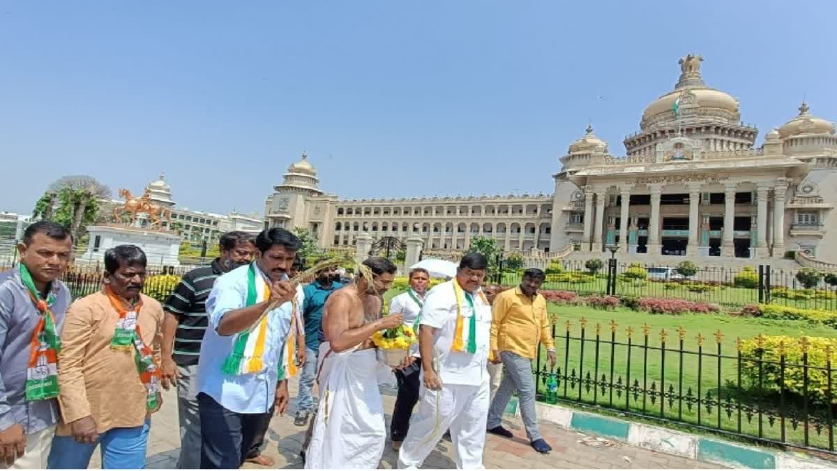 Congress workers purify Karnataka Assembly with cow urine