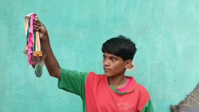 Footballer Sumati with her medal