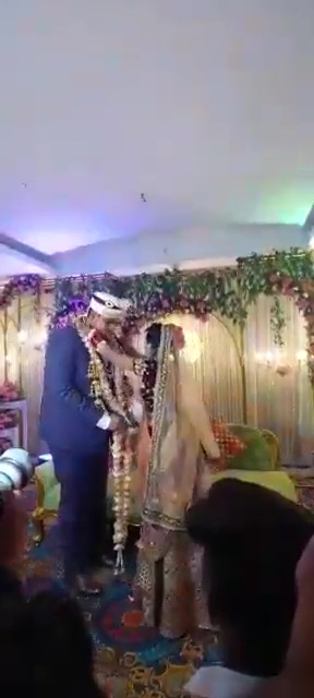 Bride runs around the stage during marriage ceremony