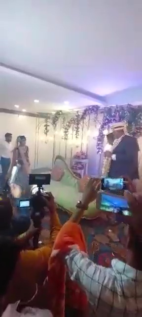 Bride runs around the stage during marriage ceremony