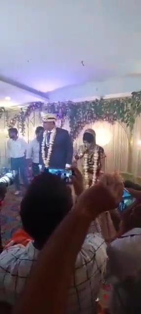 Bride runs around the stage during marriage ceremony