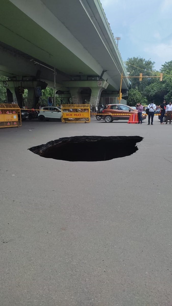 pit in road  iit flyover  delhi