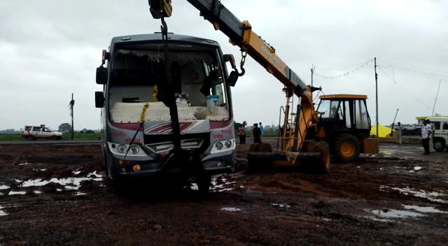 Crane carrying the bus from the scene