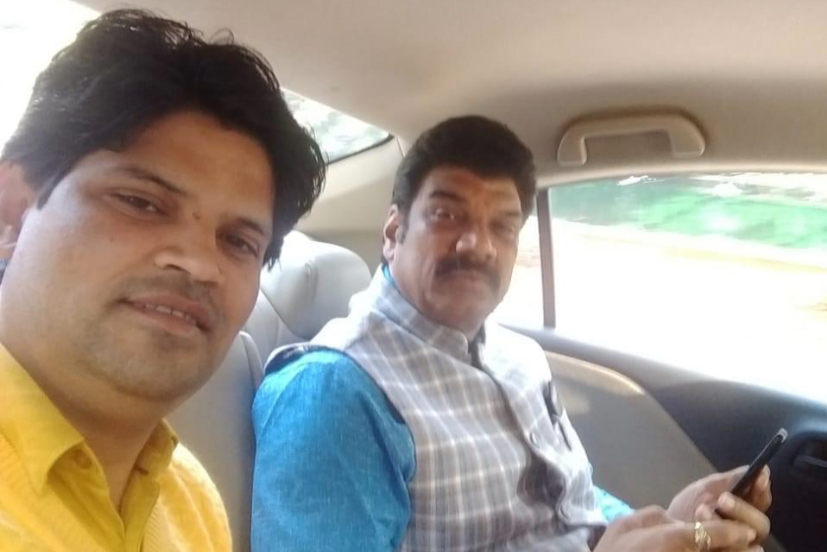 BJP leader sitting in car with Govind Singh Rajput