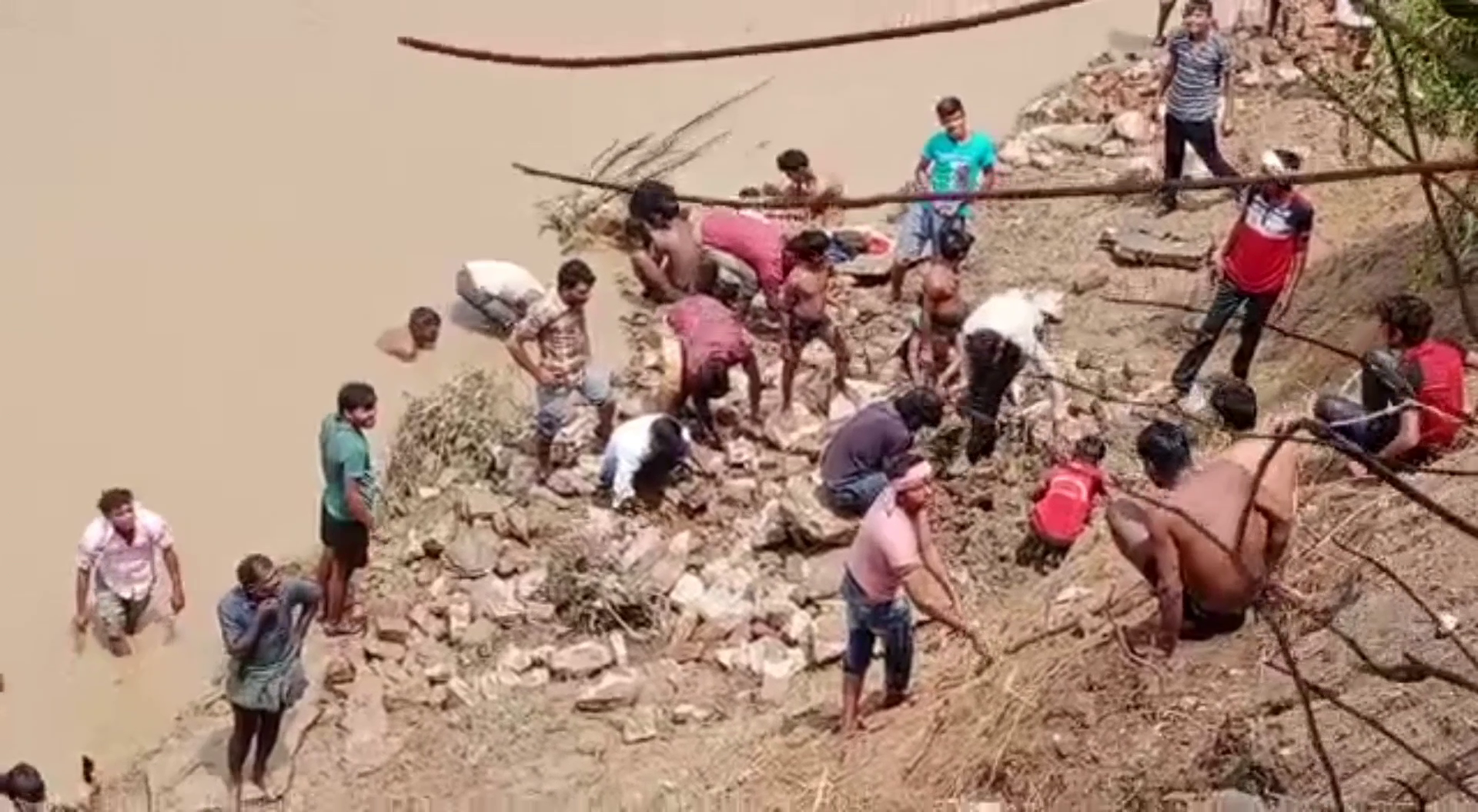 Villagers are seen showing old-fashioned coins