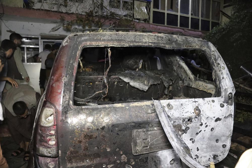 A destroyed vehicle is seen inside a house after a U.S. drone strike in Kabul.