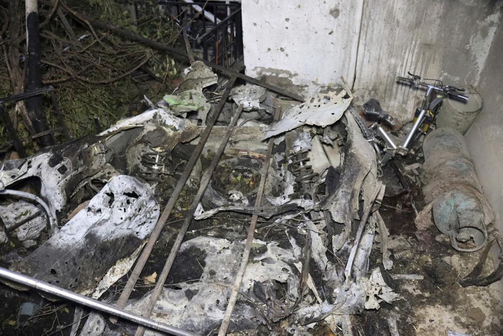 Parts of a destroyed vehicle is seen inside a house after U.S. drone strike