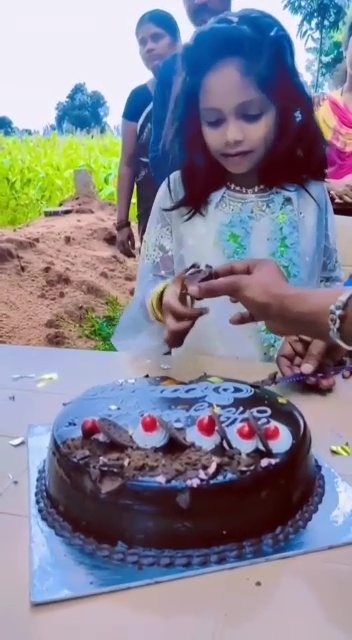 8 year old girl celebrating a birthday near her father's grave