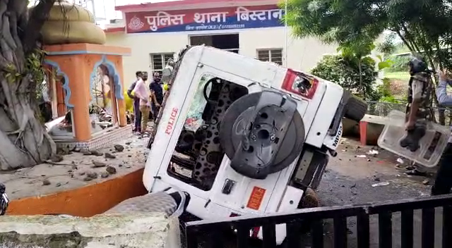 Villagers overturned a police car