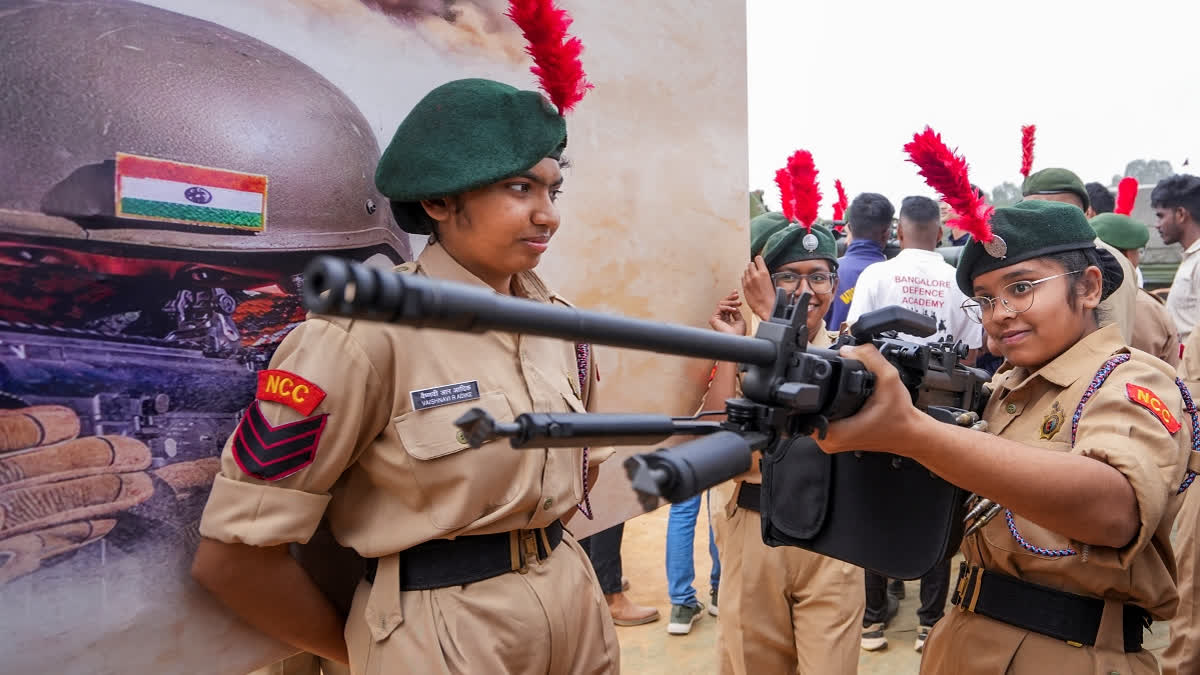 National Cadet Corps (NCC) personnel during a weapons and equipment exhibition ?Know Your Army? ahead the upcoming 77th Indian Army Day, at the Manekshaw Parade Ground, in Bengaluru, Saturday, Jan. 11, 2025.