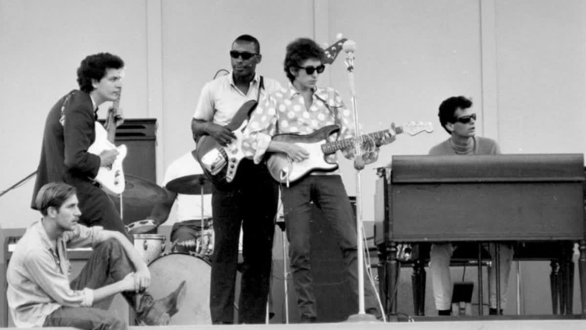 Bob Dylan and his band at the historic moment on 25th July 1965 at the Newport Folk Festival in the US