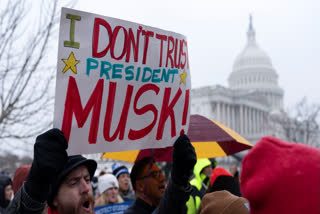 People rally against the policies of President Donald Trump and Elon Musk at the U.S. Capitol in Washington, Wednesday, Feb. 12, 2025.