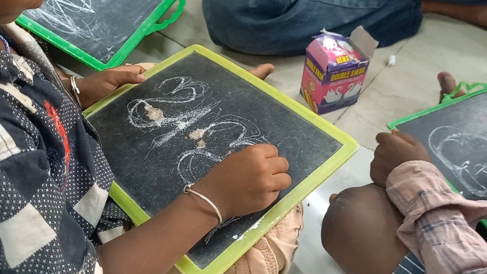 Immersed in studies, scribbling Odia and English alphabets on slates with their nimble fingers, the children at Anweshan at Dhoba Khal slum in Puri once carried loads on their shoulders to help their families