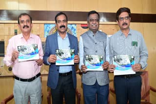 The event management team unveils the souvenir in Bangalore Press Club.