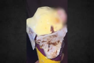 Human finger in ice cream