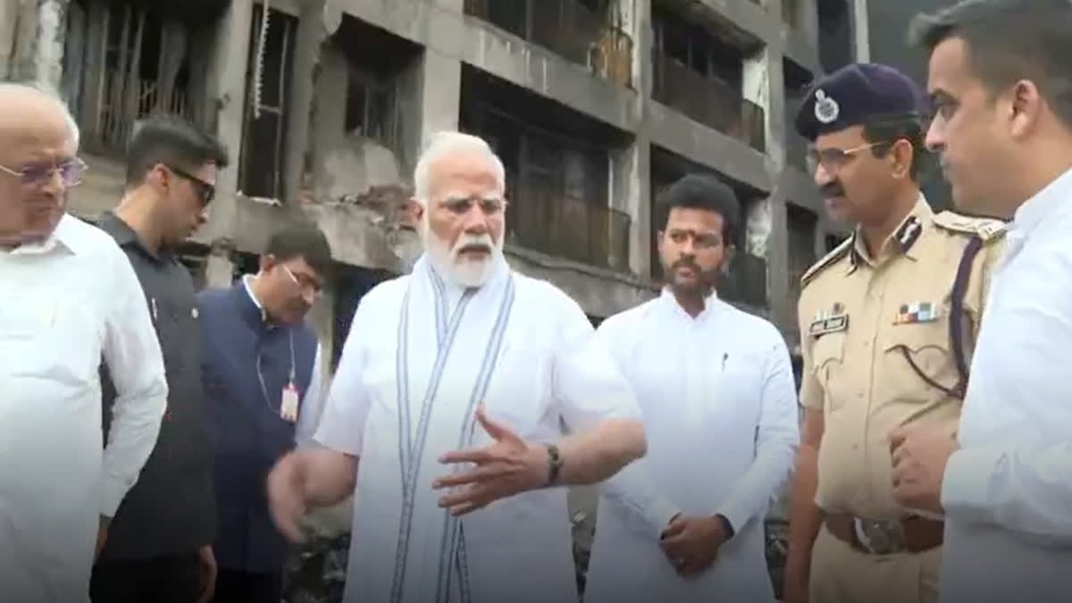 PM Modi with Civil Aviation Minister Rammohan Naidu and Gujarat Chief Minister Bhupendra Patel visits the site of yesterday's Air India plane crash, in Ahmedabad