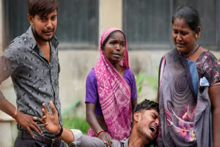 Relatives mourn the death of Akash Patni, a 14-year-old boy who was amongst the dead in yesterday's Air India flight 171 plane crash, at a hospital mortuary in Ahmedabad, Friday, June 13, 2025.