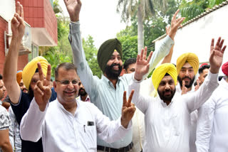 Supporters of AAP candidate Mohinder Bhagat celebrate his win from the Jalandhar (West) assembly seat in the by-election at the AAP office in Chandigarh on Saturday, July 13, 2024.