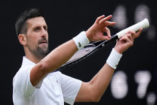 Novak Djokovic of Serbia reacts after defeating Lorenzo Musetti of Italy in their semifinal match at the Wimbledon tennis championships in London, Friday, July 12, 2024.