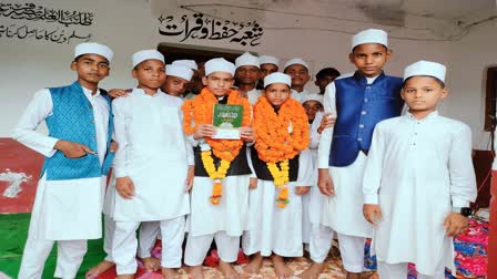 Two students have completed memorizing the Holy Quran at an early age