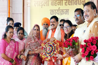 Madhya Pradesh Chief Minister Mohan Yadav being felicitated with a 'rakhi' during the "Rakshabandhan Utsav" program, at Raghunandan Garden in Ujjain on August 18, 2024.