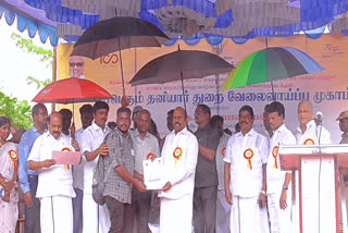 minister issued the job offer while holding an umbrella at the employment camp in Tirupattur