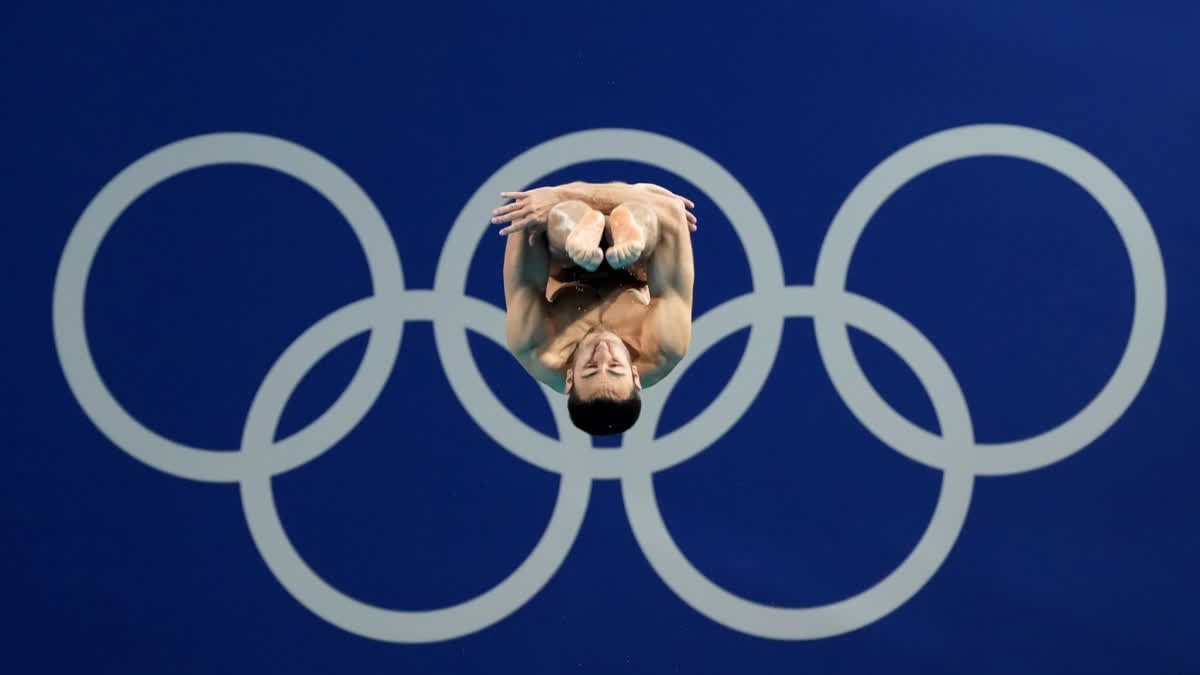 Italy's Giovanni Tocci competes in men's 3m springboard diving at 2024 Summer Olympics.