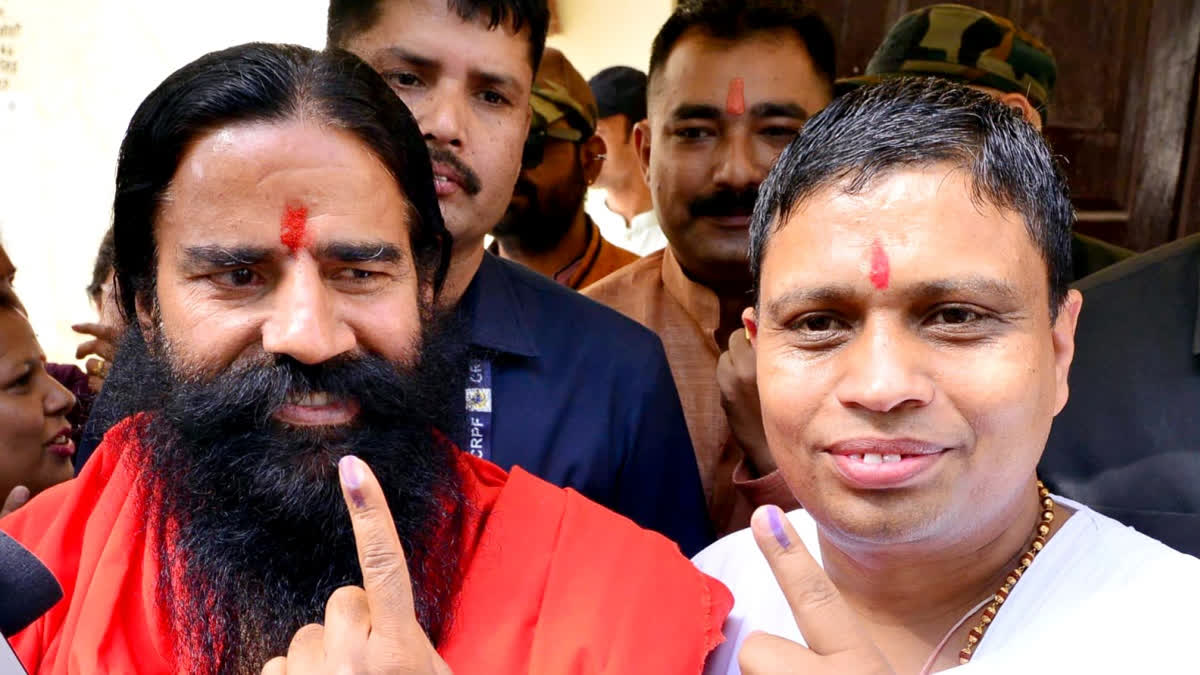 Yoga Guru Baba Ramdev (left) and Patanjali Ayurved's Managing Director Acharya Balkrishna