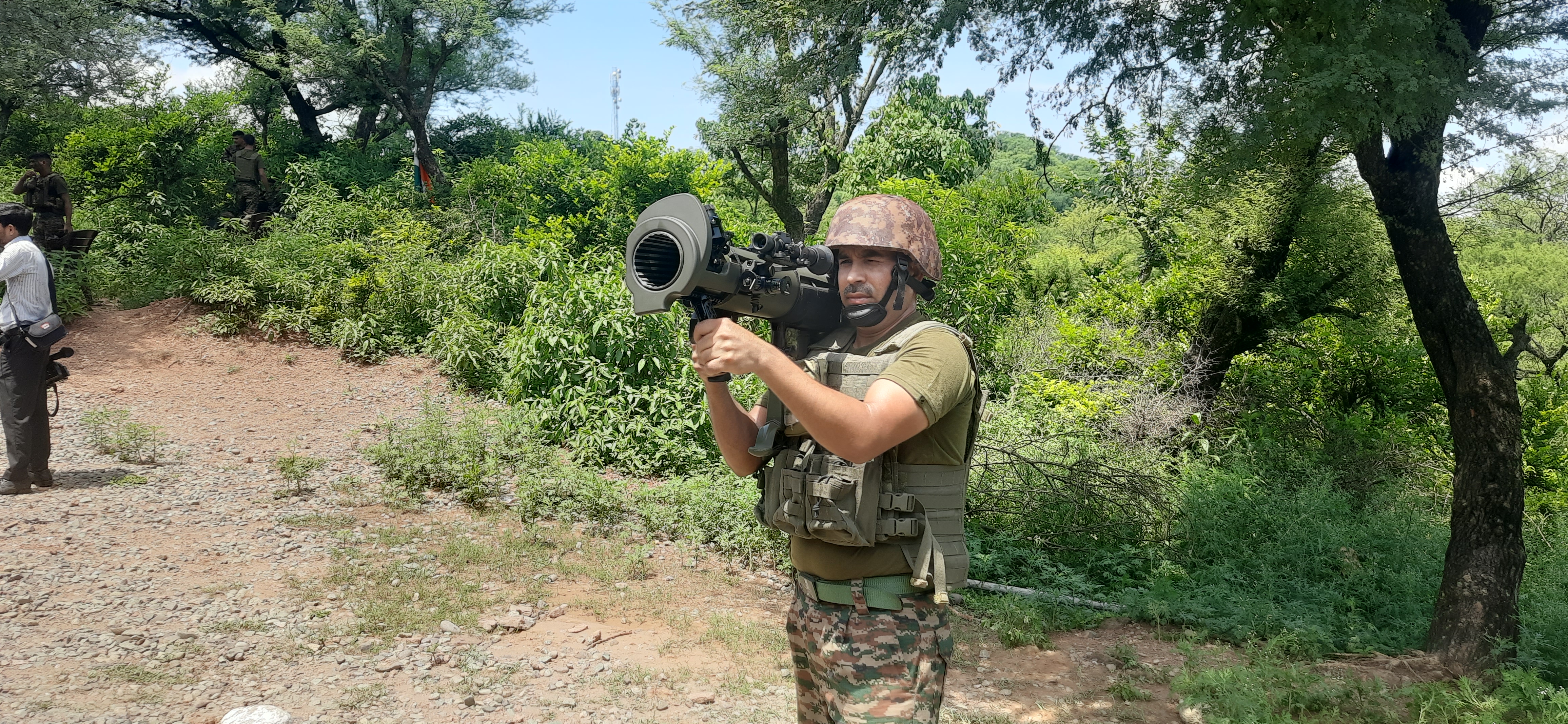 A soldier carries Sweden-made Rocket Launcher along LoC in Rajouri