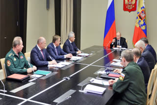 Russian President Vladimir Putin leads the meeting with top security and defense officials about the situation in Kursk and Belgorod border regions, at Novo-Ogaryovo state residence outside of Moscow, Russia, Monday, Aug. 12, 2024.