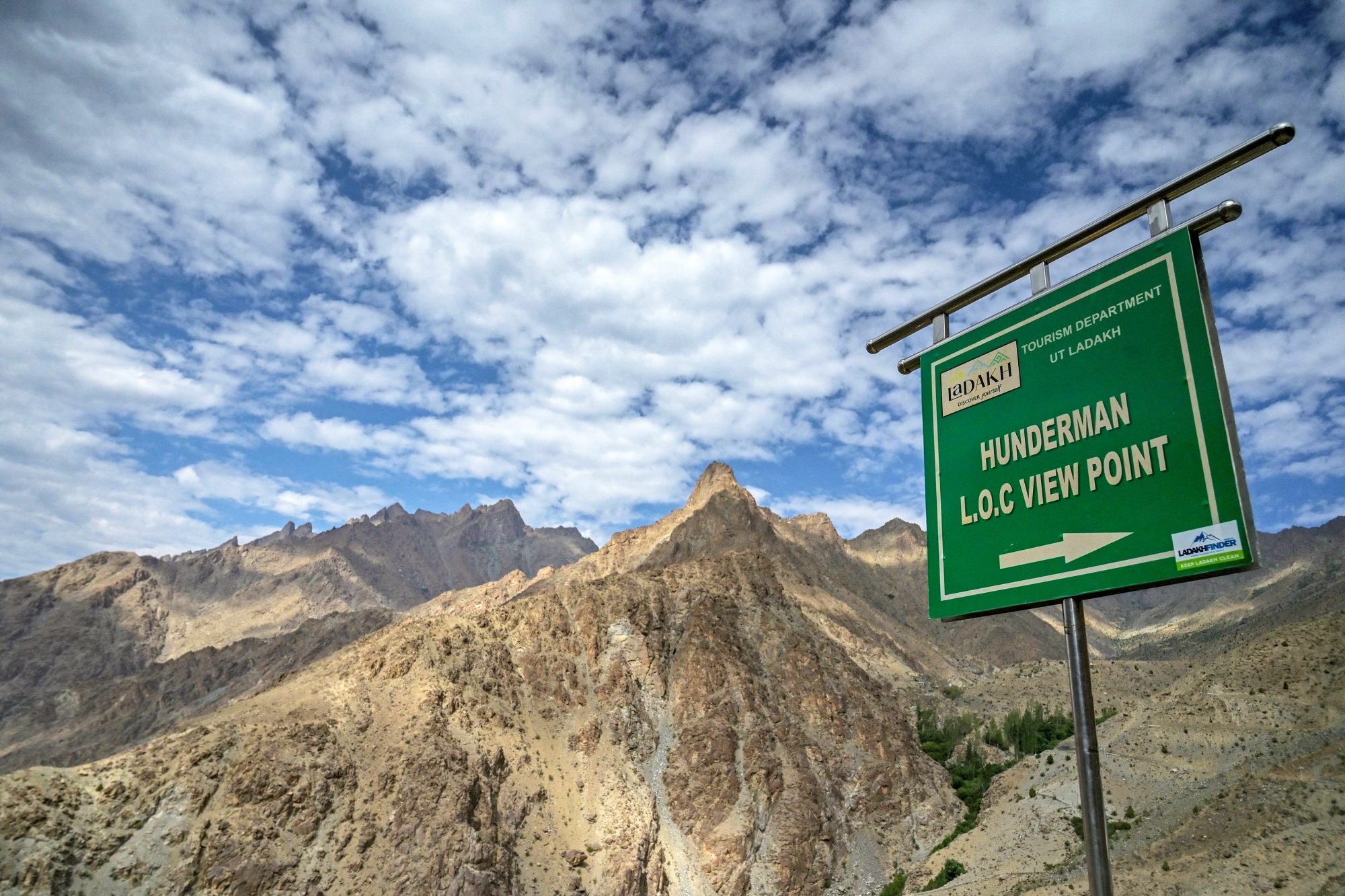 A sign board near Line of Control (LOC) - the border between India and Pakistan, at the Hunderman village in Kargil district.