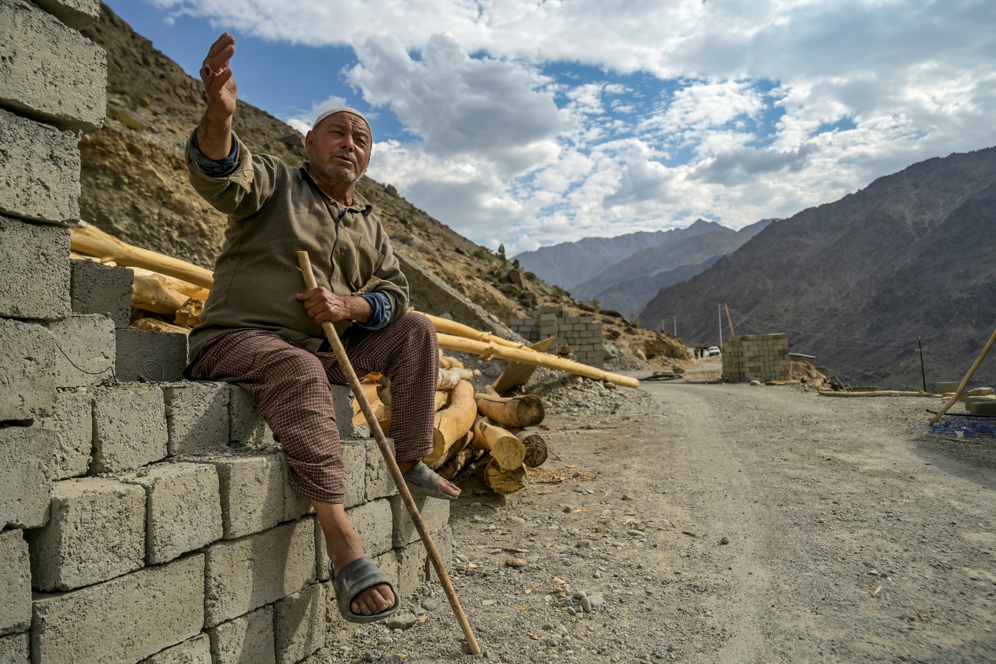 In this photograph taken on July 27, 2024 Ghulam Ahmad, an Indian apricot farmer speaks during an interview with AFP near Line of Control (LOC) - the border between India and Pakistan, at the Hunderman village in Kargil district.