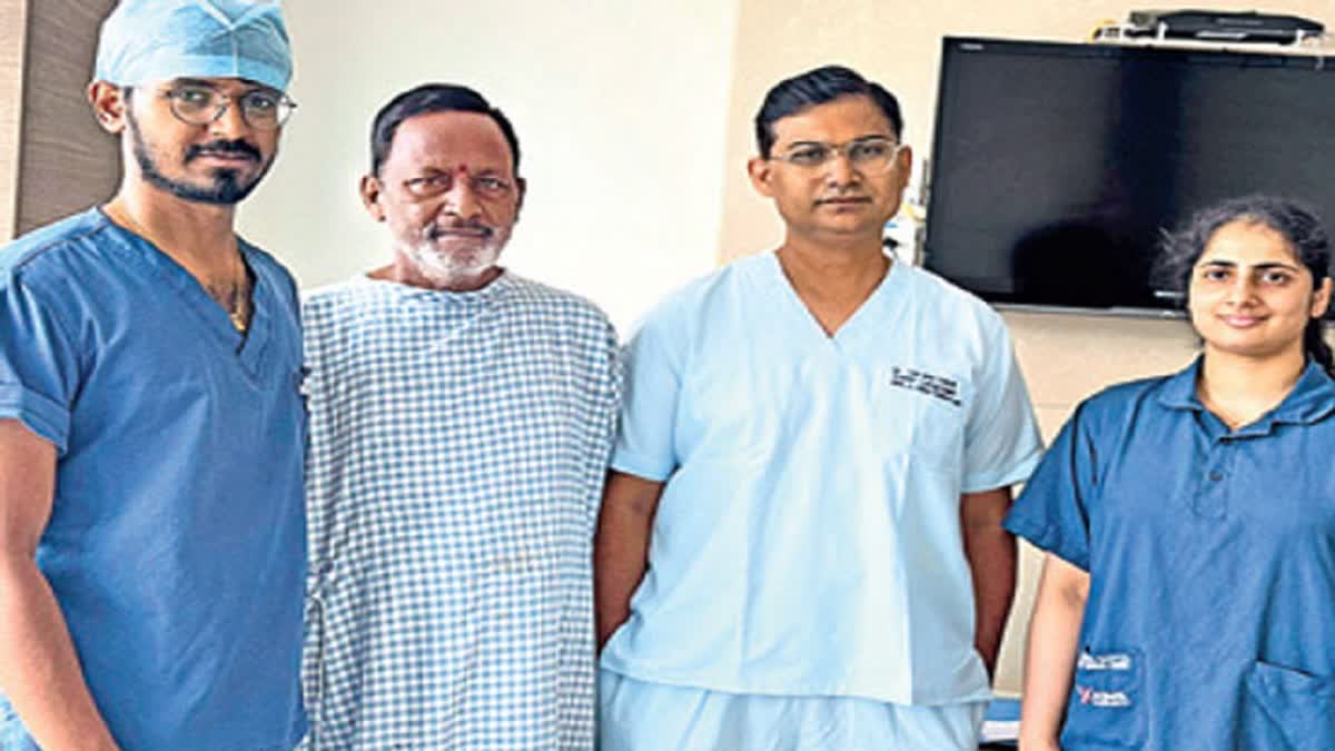 Team of KIMS Hospital surgeons with patient