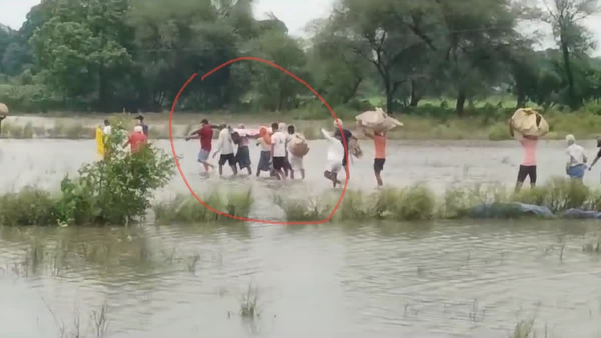 FUNERAL PROCESSION IN FLOOD