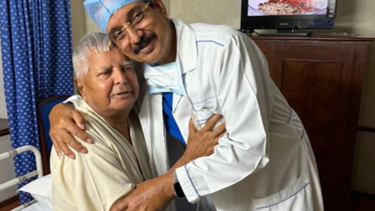 (Left) RJD Supremo Lalu Prasad Yadav with a doctor