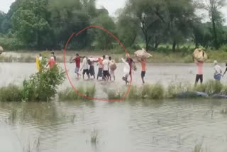 FUNERAL PROCESSION IN FLOOD