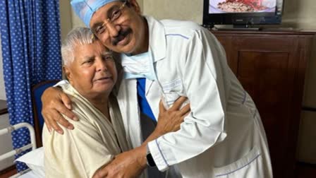 (Left) RJD Supremo Lalu Prasad Yadav with a doctor