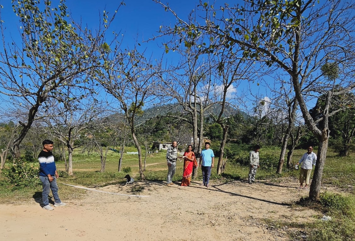 Administration staff measuring land