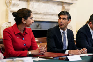 FILE - Britain's Home Secretary Suella Braverman listens to Britain's Prime Minister Rishi Sunak as he hosts a policing roundtable at 10 Downing Street, London, Thursday Oct. 12, 2023. The government says Suella Braverman has left her job as part of a Cabinet shuffle on Monday, Nov. 13, 2023. (James Manning/Pool Photo via AP, File)