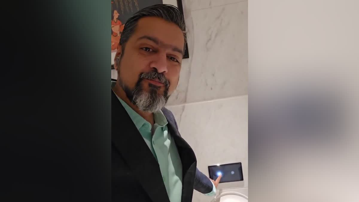 Music director Ricky Kej appreciates touch screen flush at Kempegowda International airport