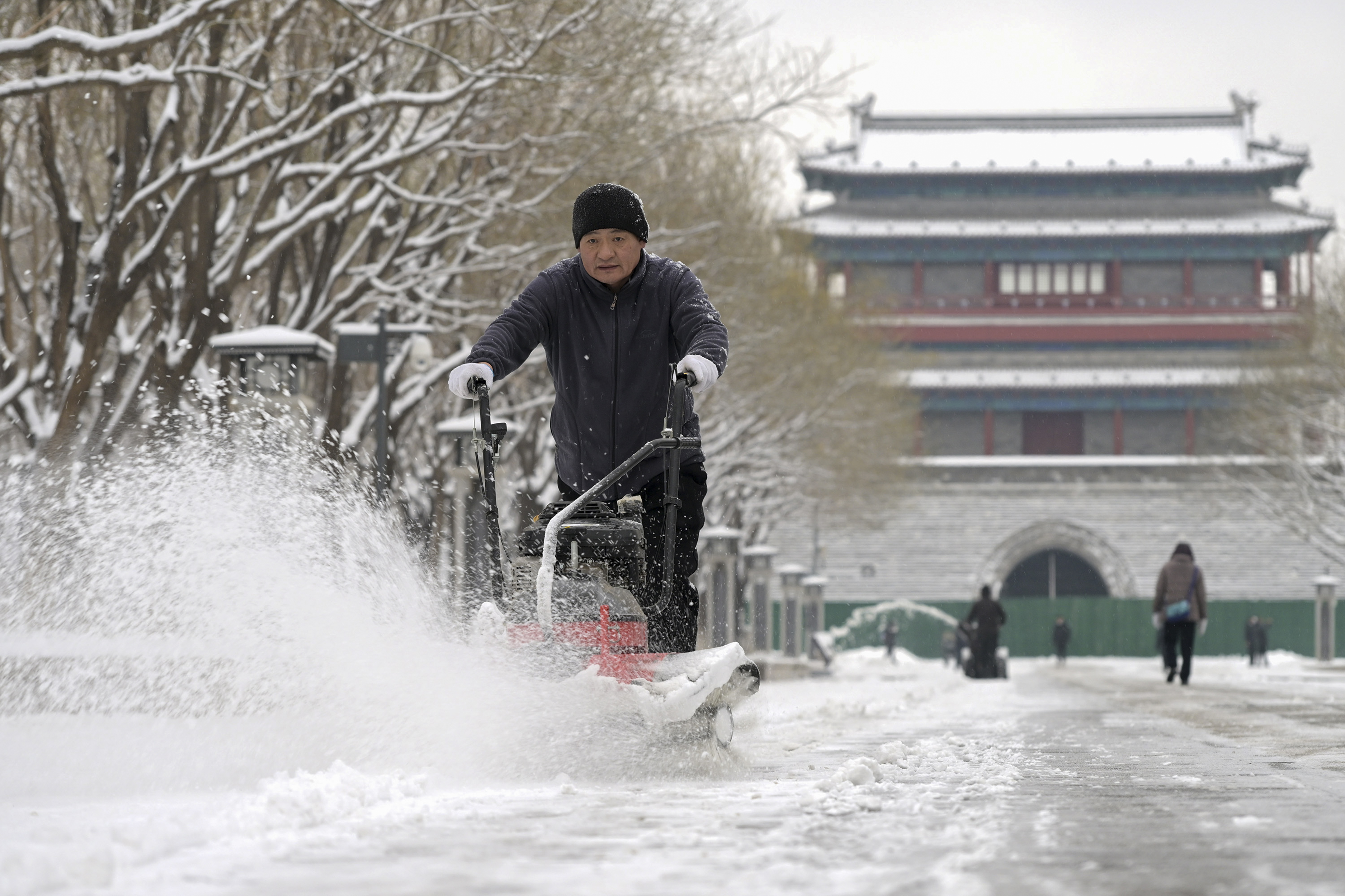 An overnight snowfall across much of northern China prompted road closures and the suspension of classes and train service on Monday.