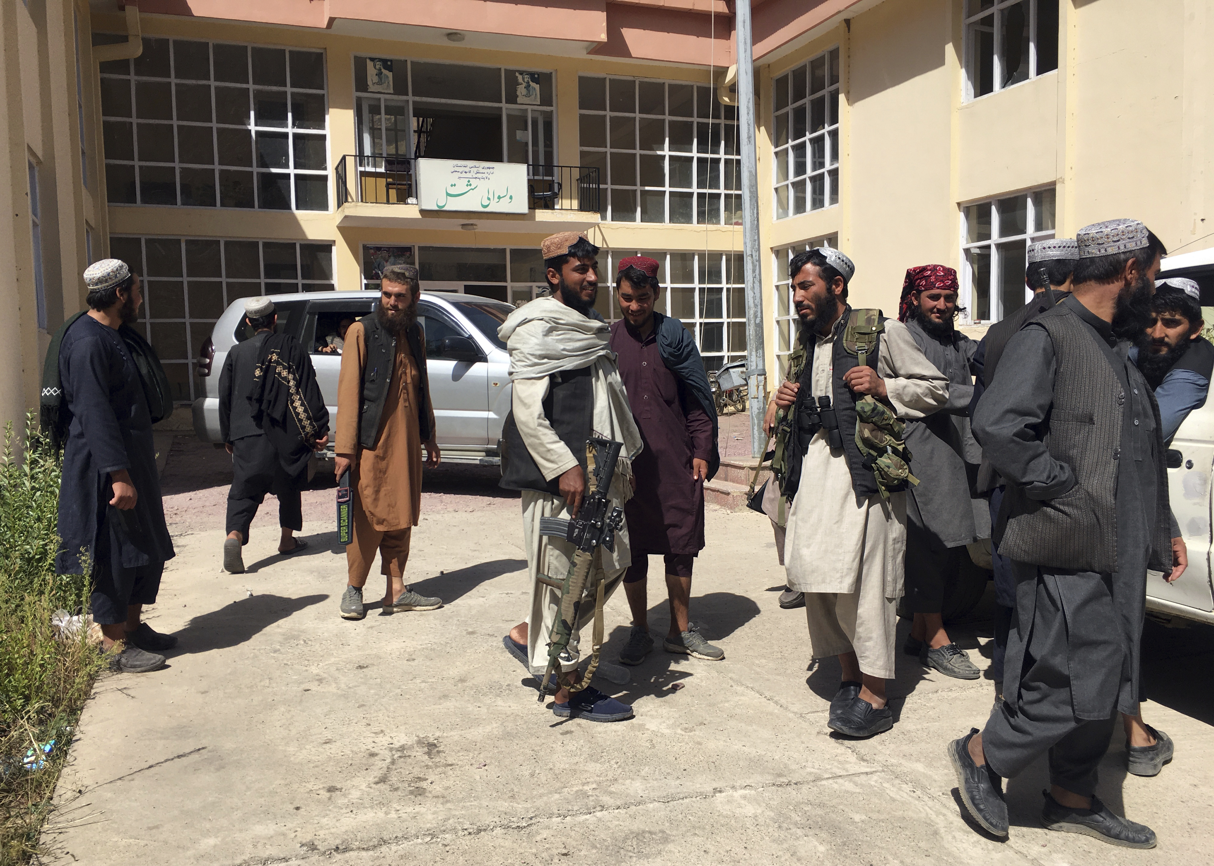 Taliban soldiers stand guard at the Shotal district of Panjshir