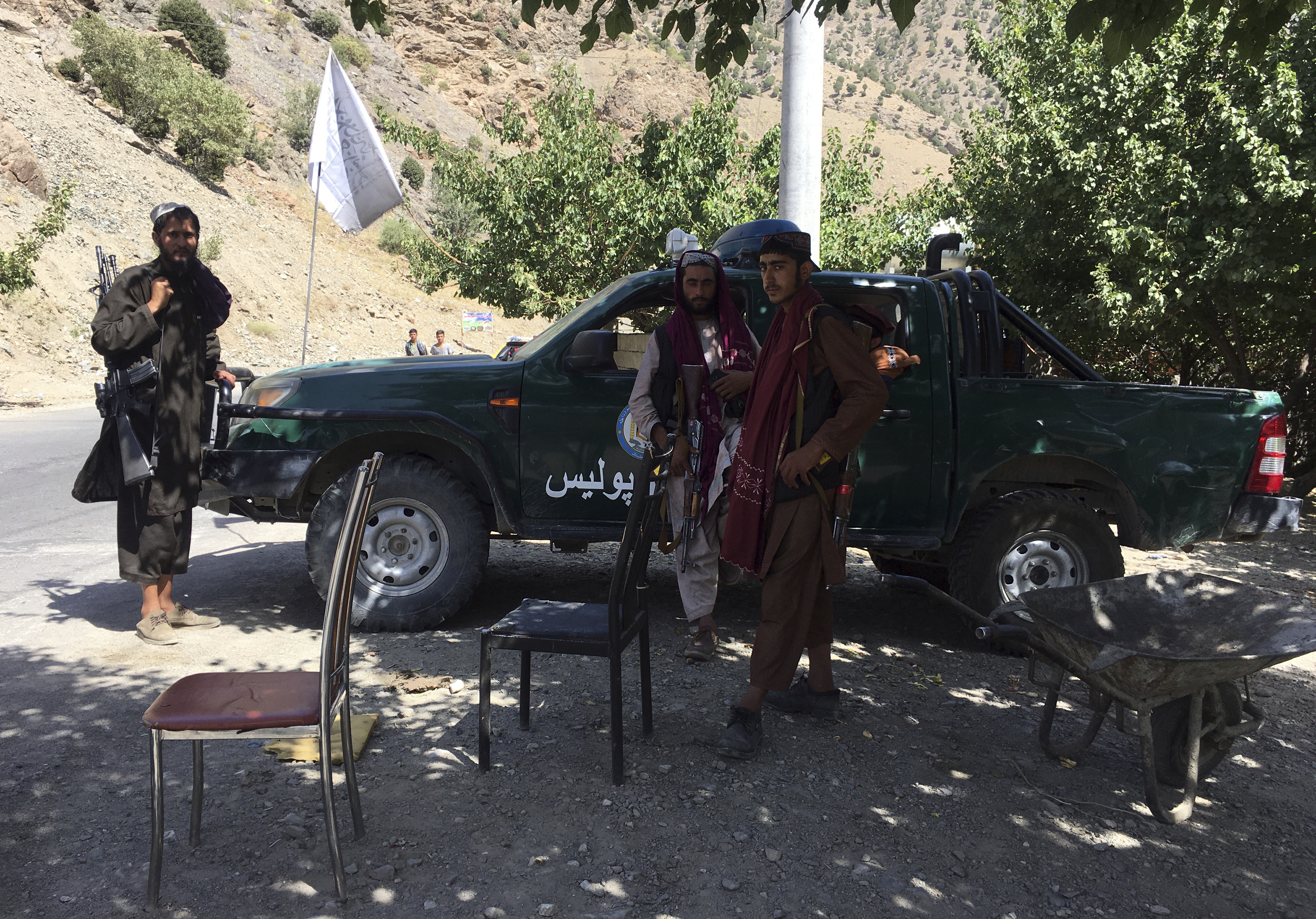 Taliban soldiers stand guard in Panjshir province